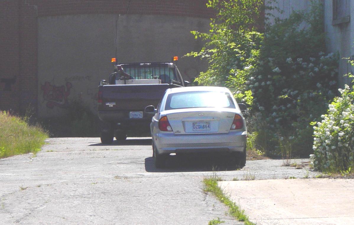 Nova Scotia: Two vehicles at the back of the Kentville Roundhouse, 4 July 2007